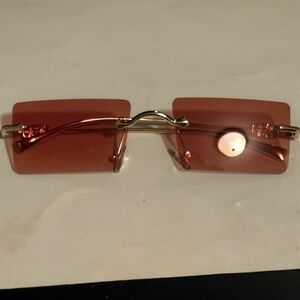 Sleek Gold and Brown Rimless Sunglasses